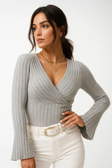Women’s gray ribbed wrap sweater with flared sleeves – elegant winter outfit